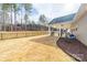 Spacious backyard featuring fenced yard, patio, shed and gazebo structures at 136 Falls Leaf Dr, Troutman, NC 28166