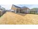 Expansive backyard featuring a covered patio ideal for outdoor entertaining and leisure at 136 Falls Leaf Dr, Troutman, NC 28166