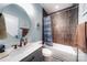 Bathroom with a large vanity, round mirror, and a tub with a tiled backsplash at 136 Falls Leaf Dr, Troutman, NC 28166
