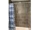 Bathtub with shower, featuring dark brown subway tile and a modern striped shower curtain at 136 Falls Leaf Dr, Troutman, NC 28166