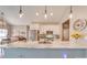 Bright kitchen featuring white cabinets, stainless steel appliances, and a large marble island at 136 Falls Leaf Dr, Troutman, NC 28166