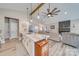 Spacious open-concept layout with marble island overlooking the dining and living areas at 136 Falls Leaf Dr, Troutman, NC 28166