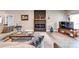 Living room featuring fireplace with decorative mantel and light hardwood floors at 136 Falls Leaf Dr, Troutman, NC 28166