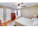 Cozy bedroom with hardwood floors, ceiling fan, and bright natural light at 1377 Buckingham Ave, Gastonia, NC 28054