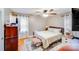 Comfortable bedroom featuring hardwood floors, ceiling fan, and natural light at 1377 Buckingham Ave, Gastonia, NC 28054
