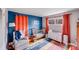 Bright Bedroom with colorful rug, crib, changing table, and decor at 1377 Buckingham Ave, Gastonia, NC 28054