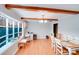 Inviting dining area with hardwood floors, large window, exposed wood beams, and a dining table set at 1377 Buckingham Ave, Gastonia, NC 28054