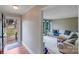 Inviting entryway with hardwood floors, a front door with glass insert, and a glimpse into the living room at 1377 Buckingham Ave, Gastonia, NC 28054