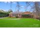 Well-maintained brick home featuring a lush lawn and inviting curb appeal at 1377 Buckingham Ave, Gastonia, NC 28054