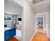 Bright hallway with hardwood floors leading to bedrooms and living area at 1377 Buckingham Ave, Gastonia, NC 28054