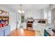 Bright kitchen featuring white cabinetry, stainless steel appliances, granite countertops, and backyard access at 1377 Buckingham Ave, Gastonia, NC 28054