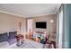 Cozy living area featuring modern lighting, a flat-screen TV, and a stylish couch with throw pillows at 1377 Buckingham Ave, Gastonia, NC 28054