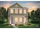 Charming two-story home features stone accents, a well-manicured lawn and is surrounded by mature trees at 14042 Penbury Ln # 334, Charlotte, NC 28278