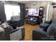 Comfortable living room offers ample seating and a media center for relaxation and entertainment at 1609 Indian Springs Nw Dr # 35, Conover, NC 28613