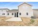 Backyard view with a concrete patio area, grass, and newly planted landscaping at 1844 Burlington Dr, York, SC 29745