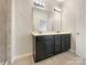 Bathroom features a double sink vanity with a large mirror and modern lighting at 1844 Burlington Dr, York, SC 29745