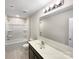 Bright bathroom with shower-tub combo, modern sink, and large mirror at 1844 Burlington Dr, York, SC 29745
