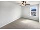 Neutrally decorated bedroom offering large window and a ceiling fan at 1844 Burlington Dr, York, SC 29745