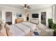 Spacious main bedroom showcasing a ceiling fan, two dressers, and entry to closet and bath at 1844 Burlington Dr, York, SC 29745
