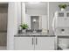 Well-lit bathroom with a granite vanity, white cabinetry and plenty of space at 210 N Church St # 1612, Charlotte, NC 28202