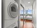 Mirrored closet in a bedroom with hardwood floors and large windows at 210 N Church St # 1612, Charlotte, NC 28202