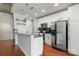 Modern kitchen featuring white cabinets, stainless steel appliances, and dark countertops at 210 N Church St # 1612, Charlotte, NC 28202