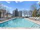 Beautiful rooftop pool surrounded by lounge chairs, offering a perfect spot for relaxation and city views at 210 N Church St # 1612, Charlotte, NC 28202