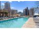 Inviting rooftop pool with lounge chairs, perfect for relaxation with stunning skyline views at 210 N Church St # 1612, Charlotte, NC 28202