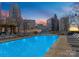 Stunning rooftop pool with city views, lounge chairs, and a relaxing atmosphere at 210 N Church St # 1612, Charlotte, NC 28202