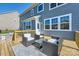 Inviting back deck with modern furniture and outdoor seating, perfect for relaxation and entertaining at 274 Sweet Briar Dr, Fort Mill, SC 29707