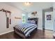 A stylish bedroom with wood floors, sports decor, and an inviting atmosphere at 274 Sweet Briar Dr, Fort Mill, SC 29707