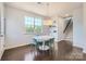 Breakfast room featuring a round table, modern chairs, and views of the staircase and backyard at 274 Sweet Briar Dr, Fort Mill, SC 29707