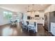 Open concept kitchen with island seating and stainless appliances, seamlessly connecting to the breakfast area at 274 Sweet Briar Dr, Fort Mill, SC 29707