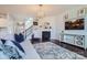 Cozy living room featuring a fireplace, staircase and comfortable seating at 274 Sweet Briar Dr, Fort Mill, SC 29707