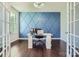 Stylish home office with blue accent wall and marble desk at 274 Sweet Briar Dr, Fort Mill, SC 29707