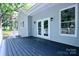 Home features a spacious back porch with white trim and a door leading to the interior at 315 Confederate St, Fort Mill, SC 29715