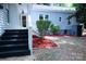 Home exterior with lush landscaping, white steps leading up to the entry and natural mulch at 315 Confederate St, Fort Mill, SC 29715