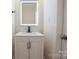 Modern bathroom vanity with a sleek countertop, contemporary faucet, and illuminated mirror at 315 Confederate St, Fort Mill, SC 29715