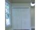 Hallway view with bi-fold closet doors, a window and neutral color walls at 315 Confederate St, Fort Mill, SC 29715