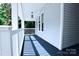 Exterior showing a covered front porch with painted decking and a traditional ceiling fixture at 315 Confederate St, Fort Mill, SC 29715