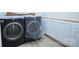 Convenient laundry room equipped with new washer and dryer and ample storage cabinets for a clutter-free space at 315 Confederate St, Fort Mill, SC 29715