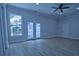 Large living room featuring a ceiling fan, neutral paint, a patio door entrance, and lots of natural light at 315 Confederate St, Fort Mill, SC 29715
