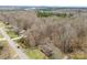 An aerial view of a house and yard surrounded by bare trees at 32 Bowen Dr, Belmont, NC 28012
