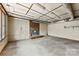 Spacious unfinished basement with concrete floor, brick accent and industrial lighting at 32 Bowen Dr, Belmont, NC 28012