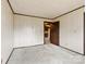 Bedroom with a door and light green carpet flooring throughout at 32 Bowen Dr, Belmont, NC 28012