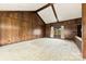 Large living room featuring vaulted ceilings, wood walls, and ample space at 32 Bowen Dr, Belmont, NC 28012