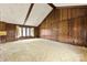 A bright, spacious living room with vaulted ceilings and wood paneling at 32 Bowen Dr, Belmont, NC 28012