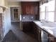 Kitchen featuring a large sink with stainless steel appliances and brick backsplash at 322 E Houston St, Monroe, NC 28112