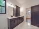 Elegant bathroom featuring dual sinks, granite countertops, and cabinet storage at 4024 Landsford Rd, Marshville, NC 28103