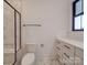 Bathroom featuring a white toilet, modern vanity, black hardware, and a glass shower with marble tile at 4024 Landsford Rd, Marshville, NC 28103
